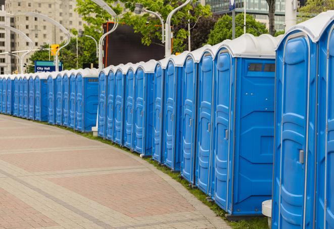 a row of portable restrooms at a fairground, offering visitors a clean and hassle-free experience in Belleville